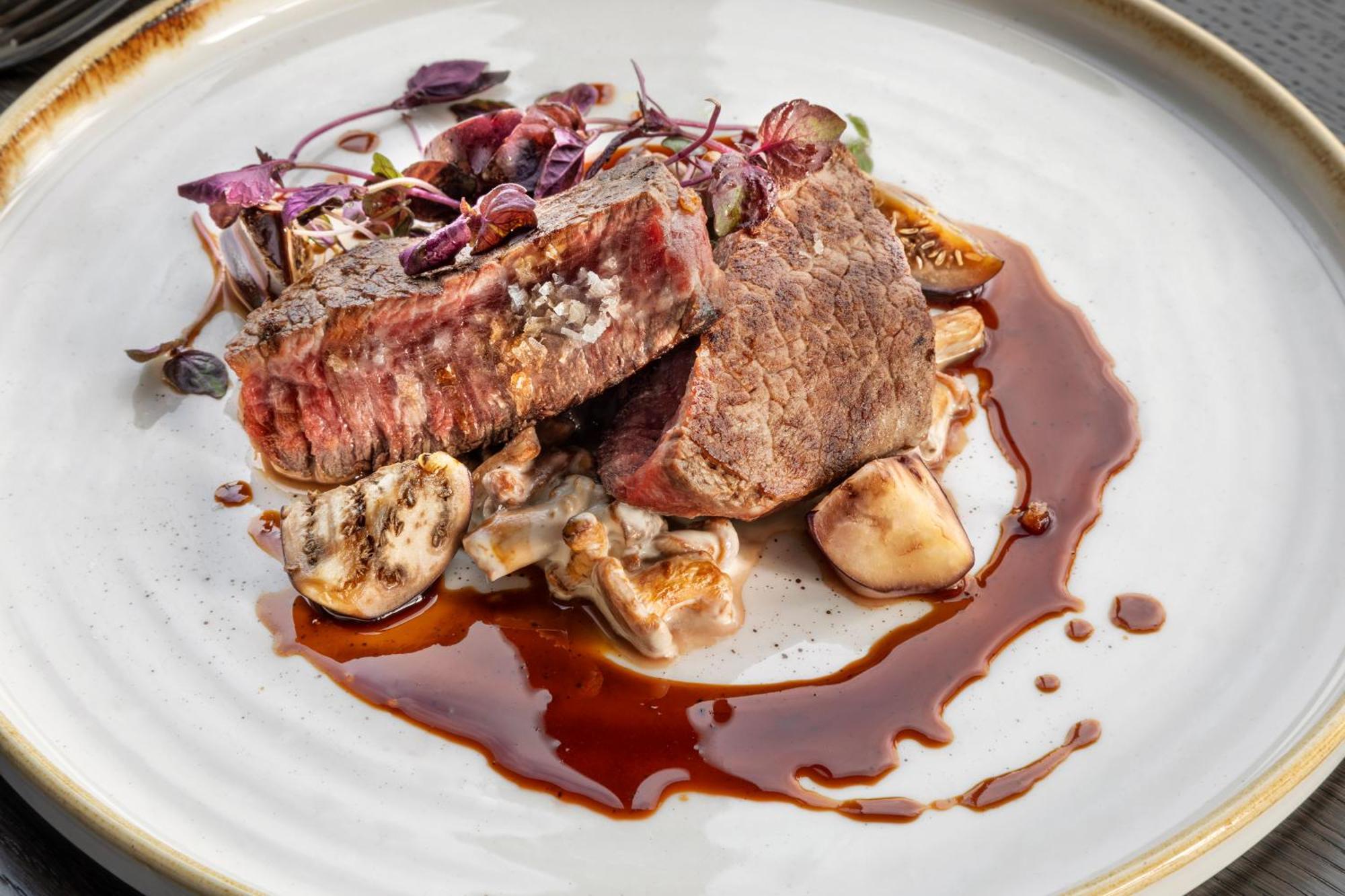 Hotel Melia Vienna Esterno foto A steak prepared with a reduction of red wine